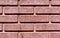 Red stylized brick wall texture.