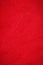 Red suede genuine leather background. Velvet red background close-up photo