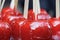 Red sugar apples on a stick. Eastern sweets