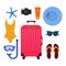 Red suitcase and beach accessories around. Summer travelling concept. Flip flops, snorkeling mask, sunglasses, swimsuit, sun cream