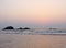 Red Sun setting at Horizon over Sea at Muzhappilangad Drive-in Beach, Kannur, Karala, India - Natural Background