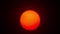 Red sun sphere in thick smog