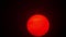 Red sun sphere in thick smog