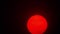 Red sun sphere in thick smog