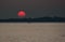Red Sun at Sunset at Sea with Fishing Boat