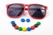 Red sunglasses and colorful candys.