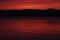 A Red Sunset Over The Great Sacandaga Reservoir In The Adirondack Mountains Of New York