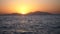 Red sunsets over sea video 4K. The sun touches horizon. Red sky, yellow sun and amazing sea. Summer sunset seascape. Red
