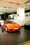 The Red super car Porsche in show room at center of siam paragon pride of bangkok Thailand.