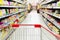 Red supermarket inside the empty shopping cart