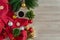 Red sweater, coffee and Christmas ornament balls decoration on wood table.