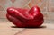 Red sweet giant pepper on a background of terracotta tiles