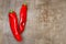 Red sweet italian peppers on a rusted metal table