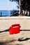 Red swing on the beach