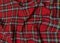 Red tartan woolen school uniform fabric material. Scottish classic seamless flannel cloth. Traditional wave pattern for