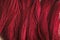 Red tassels background close up