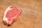 Red and Tasty Steak on a Wooden Table