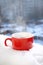 Red Tea Cup In Snow in Morning Winter Mood Christmas