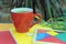 Red tea empty space mug mockup, outdoor photo