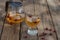 Red tea in a transparent cup on a wooden table, rosehip tea, rustic