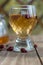 Red tea in a transparent cup on a wooden table, rosehip tea, rustic