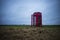 A red telephone box in the middle of nowhere