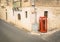 Red telephone cabin in the old town of Victoria in Gozo Malta