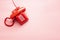 Red telephone on pink desk