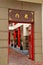 Red temple door and bonsai plants