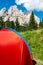 Red Tent in Mountains. Outdoor Adventure and Leisure Pursuit Concept