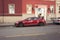 Red Tesla model S, full-size all-electric five-door