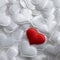 Red textile heart on white hearts background
