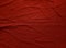 Red texture cloth background. Matted and striped surface