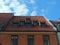 Red tile roof with garrets.