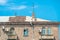 Red tile roof and TV antenna above