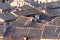 Red tile roofs and antennas on traditional italian buildings