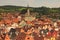 Red tile roofs cityscape. Church of Saint Vitus- UNESCO World Heritage Site. Summer sunny day. Cesky Krumlov Krumau