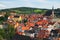Red tile roofs cityscape. Church of Saint Vitus- UNESCO World Heritage Site. Summer sunny day. Cesky Krumlov Krumau, Czech Repub