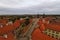 Red tile roofs in medieval city. Aerial view of Telc with main square and towers of the Church of the Holy Name of Jesus