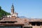 Red tiled roofs and an ancient church in Carona