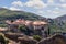 Red tiled roofs, chimneys and ornamented arched windows of religious medieval buildings of The Holy St Varlaam Monastery