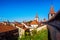 Red tiled roofs and wall towers in Old Town Murten, Switzerland