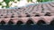 Red tiles on the roof of an old house. Closeup.4k