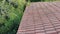 Red tiles on the roof of an old house. Closeup.4k