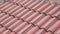 Red tiles on the roof of an old house. Closeup.4k