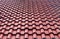 Red tiles roof textured background. Closeup exterior