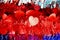 red tinsel with bright hearts on a blue background. love concept valentine day