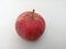 Red tiny apple in a white background