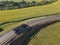 Red tipper truck on street road highway transportation. Semi-truck countryside aerial view