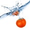 Red tomato dropped into water